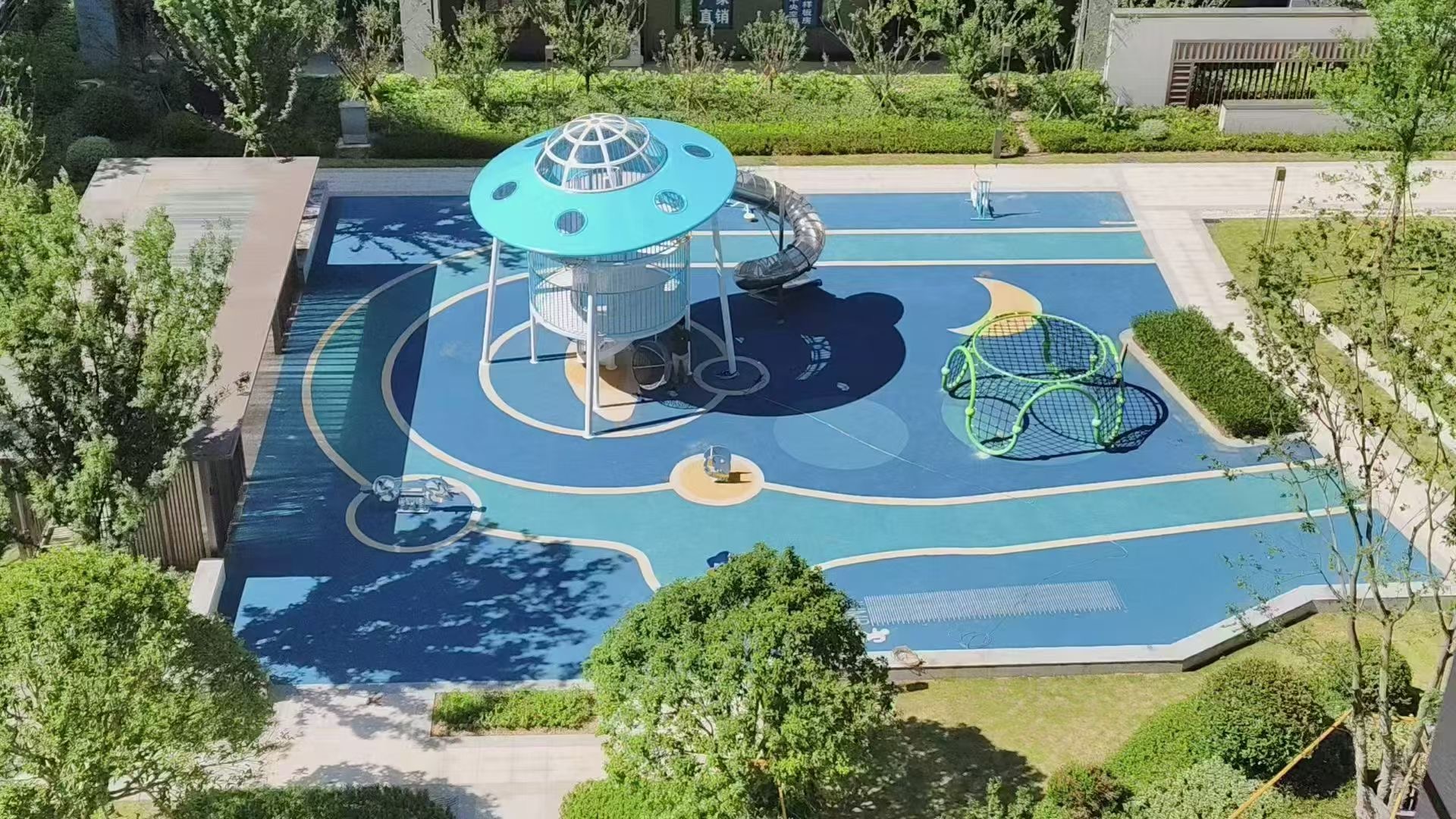 Spiral tower and climbing net for family courtyard Outdoor play zone with space concept for apartment complex