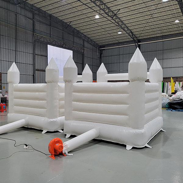 Inflatable twin bounce castles with blowers and mesh sides