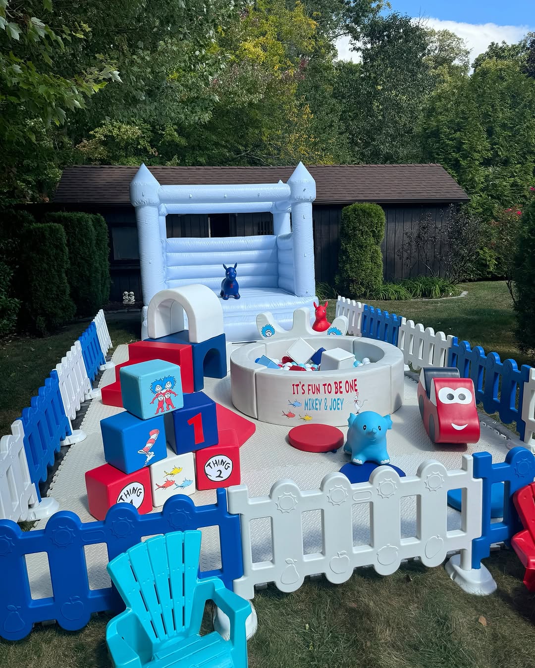 Pastel blue inflatable bouncer with white round ball pit for children blue and red play set