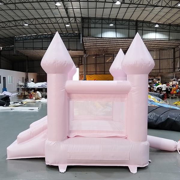 Commercial grade pink inflatable bouncer with slide for rental use