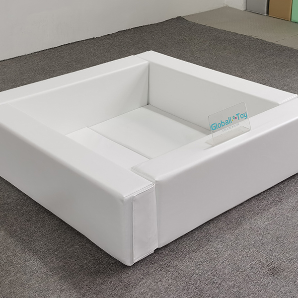 White foam padded square ball pit with seats