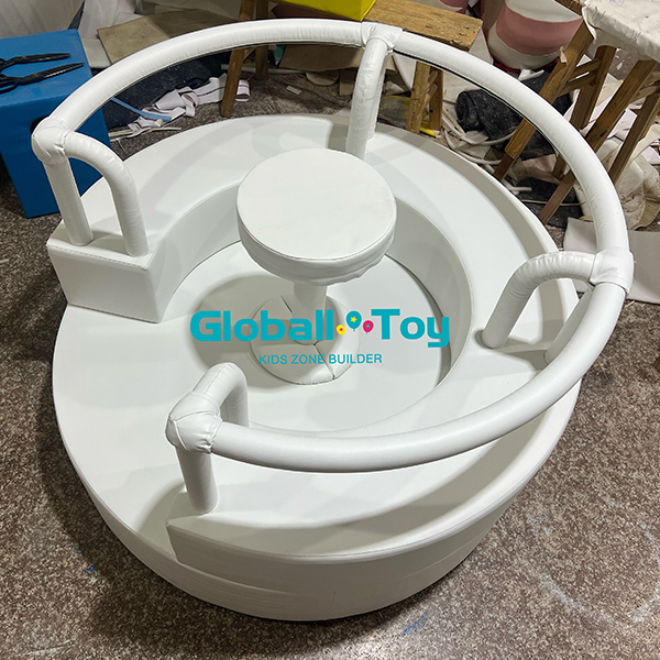 Kids indoor rotating merry go round toy in white soft foam material for playgrounds