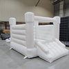 White inflatable bounce house with slide for indoor party setup