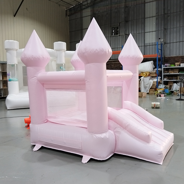 Princess themed pastel pink inflatable jumping castle for birthday hire