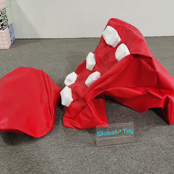 Red inflatable climbing tunnel before inflation