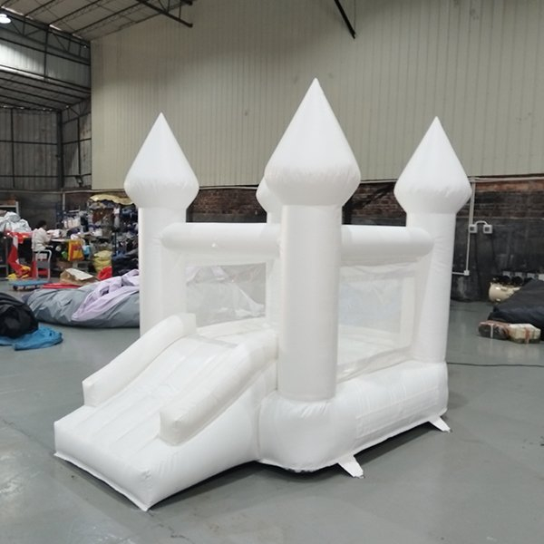 White inflatable bounce castle with slide for backyard parties
