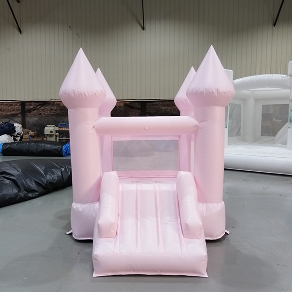 Pastel pink inflatable castle jumper with mesh windows for safety