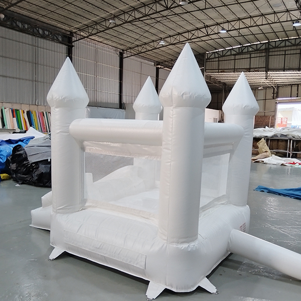 White bounce castle with turrets for toddlers and indoor play centers