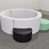 white foam pit ring with black and green soft entrance pads