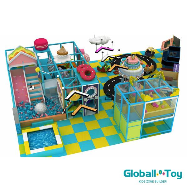 commercial indoor play structure with candy house theme and play zones