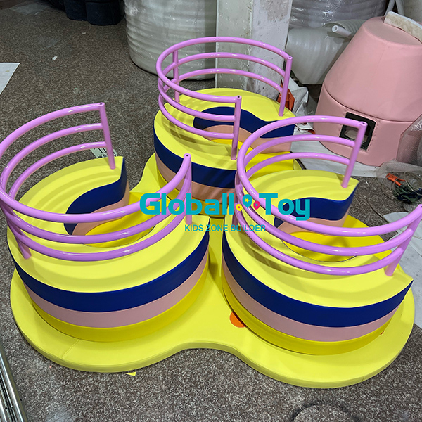Yellow twin spiral soft play slide for toddler activities