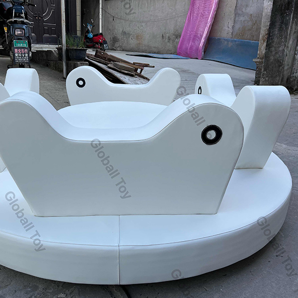 Kids roundabout soft play equipment with white animal seats