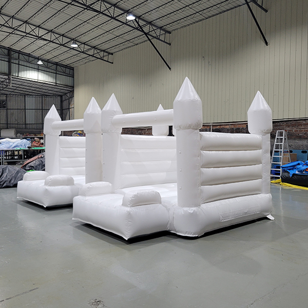 White double inflatable bounce house with castle design
