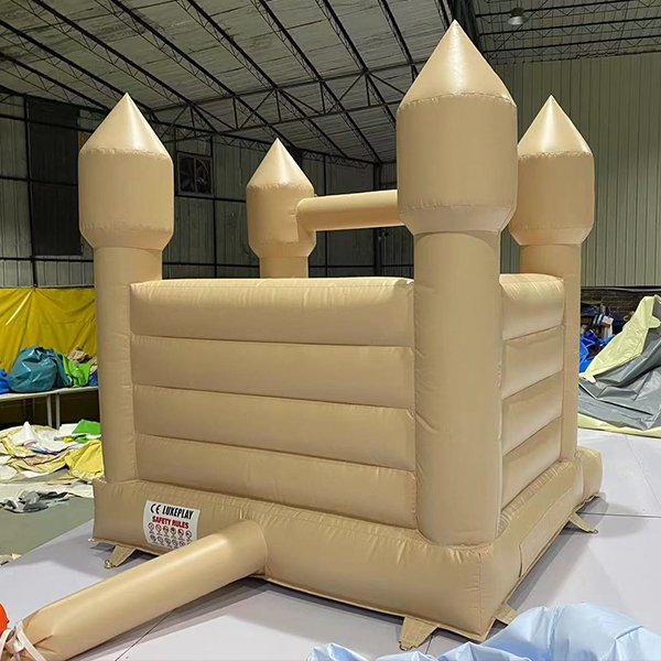 Elegant bounce house with pointed towers for indoor events