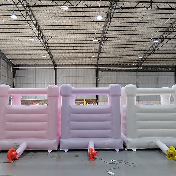 Soft pastel jumping castle for wedding rental