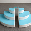 Blue and white curved foam climbing steps for toddler soft play area