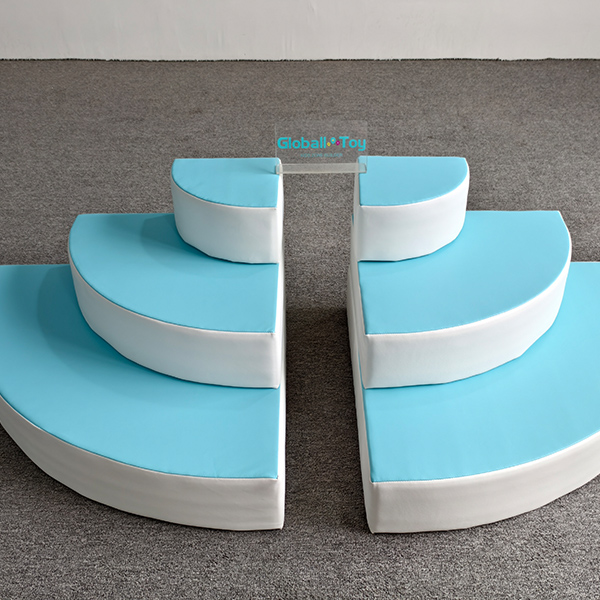 Blue and white curved foam climbing steps for toddler soft play area