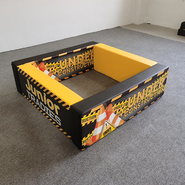 Square indoor play yard with caution tape graphics for soft play centers