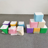 Flattened and stacked soft play foam cubes