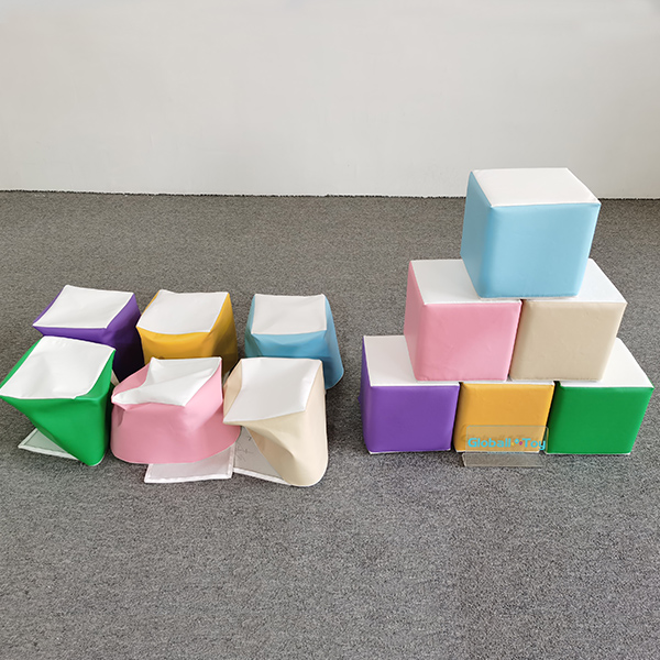 Flattened and stacked soft play foam cubes