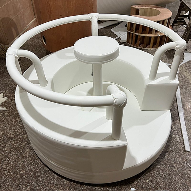 Soft cushioned round spinner for indoor kids play area