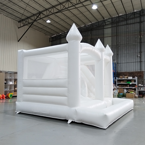 Commercial grade white bounce house with slide and netting