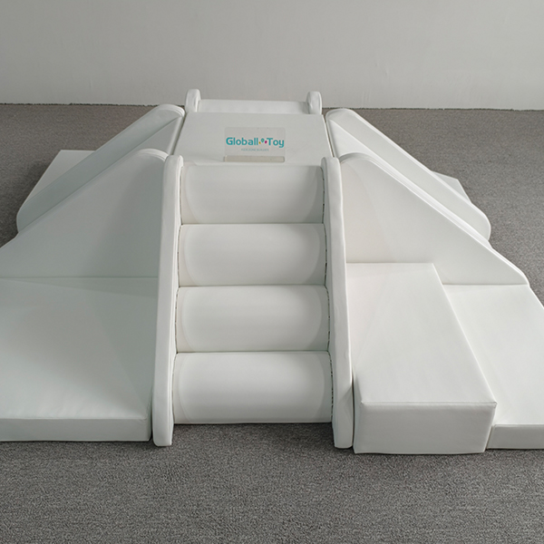 white soft play climbing and sliding blocks