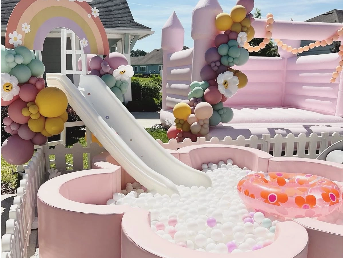 Pastel Pink Inflatable Castle with Slide And Ball Pit | Outdoor Soft Play Equipment for Kids Parties