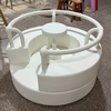 White soft play roundabout with handles for indoor playground