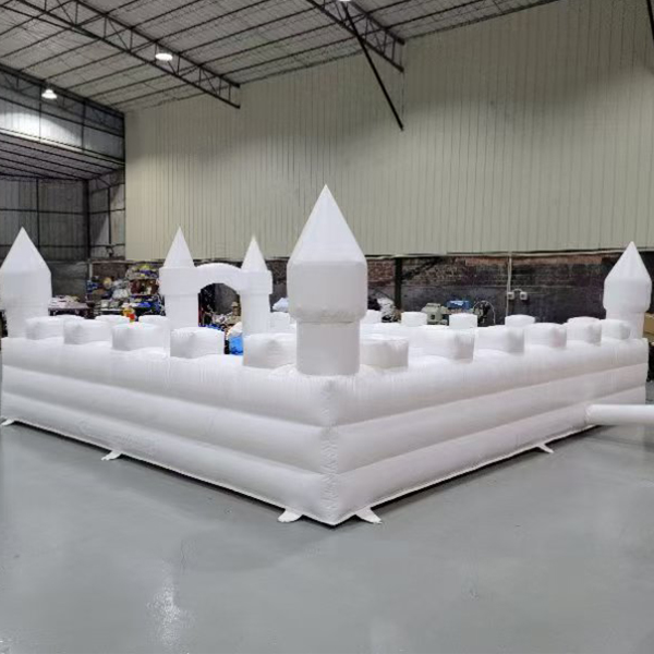 Large white inflatable playhouse with turrets for children parties