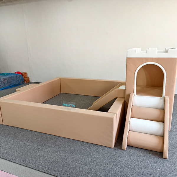 beige soft play castle with slide for toddler rental