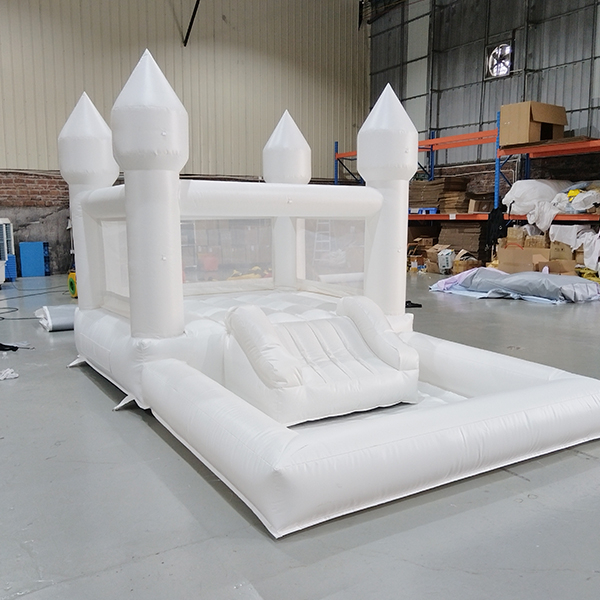 white-inflatable-castle-with-slide-for-event-rentals