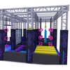 illuminated ninja warrior park with suspended ropes swing bars and obstacle stations