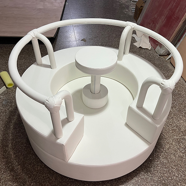White carousel soft play equipment for children's play area.
