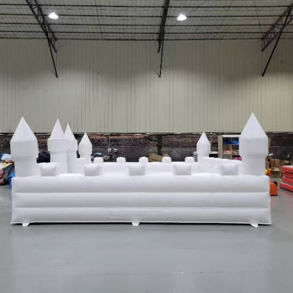 White bouncy castle with net protection for weddings and events