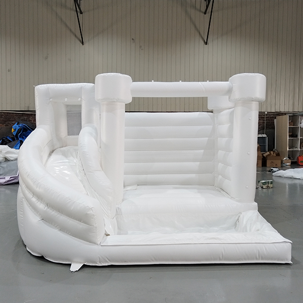 White inflatable bouncy castle with slide for kids party