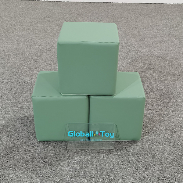 Green soft foam cubes for children’s play area 