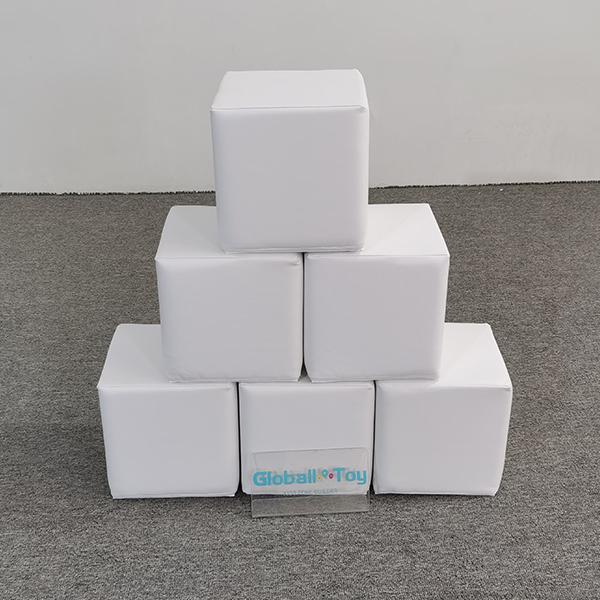 white soft play cubes stacked
