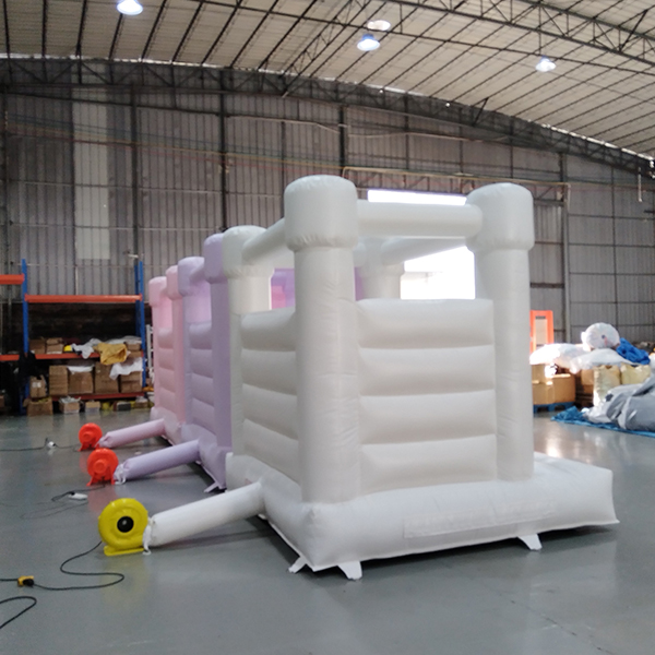 Pastel mini bouncer house for toddler party zone