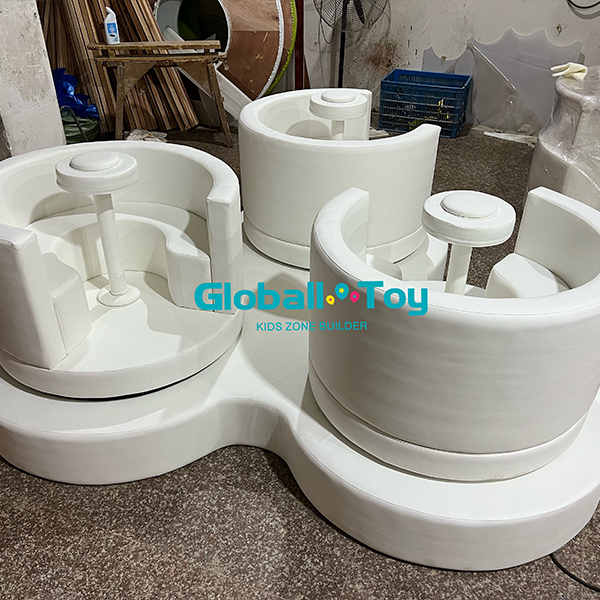 White indoor soft play spinner seats for toddlers with backrest and railing