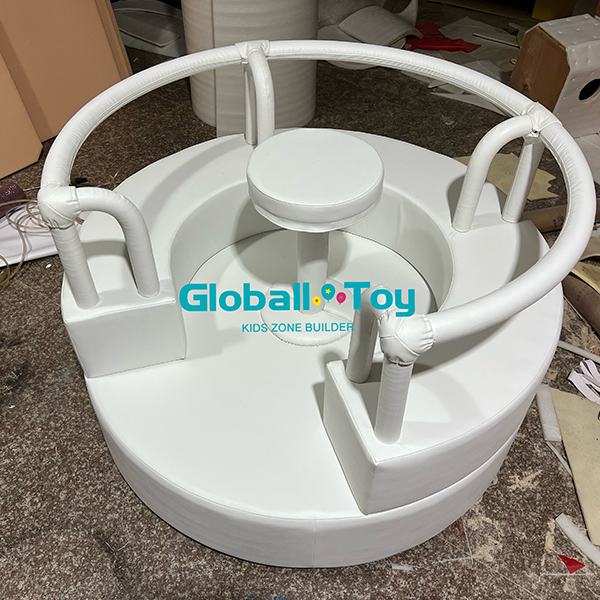 Soft round rotating play equipment with seating and center support for kids zone