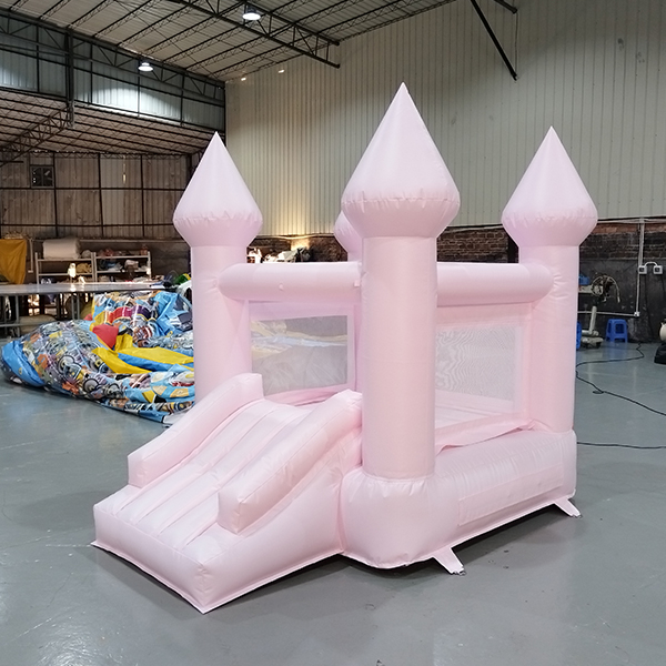 Pink inflatable castle bounce house with slide for backyard party rental