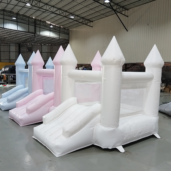 pastel inflatable castle with slide for kids parties
