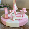 Soft playground rotating pony ride in pastel pink color