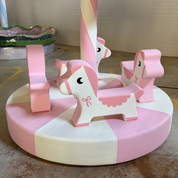Soft playground rotating pony ride in pastel pink color