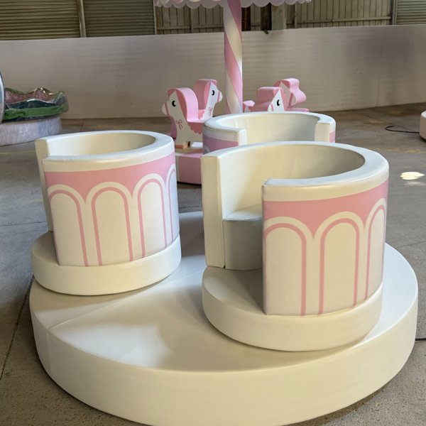 Teacup carousel ride set with round padded seats for toddlers